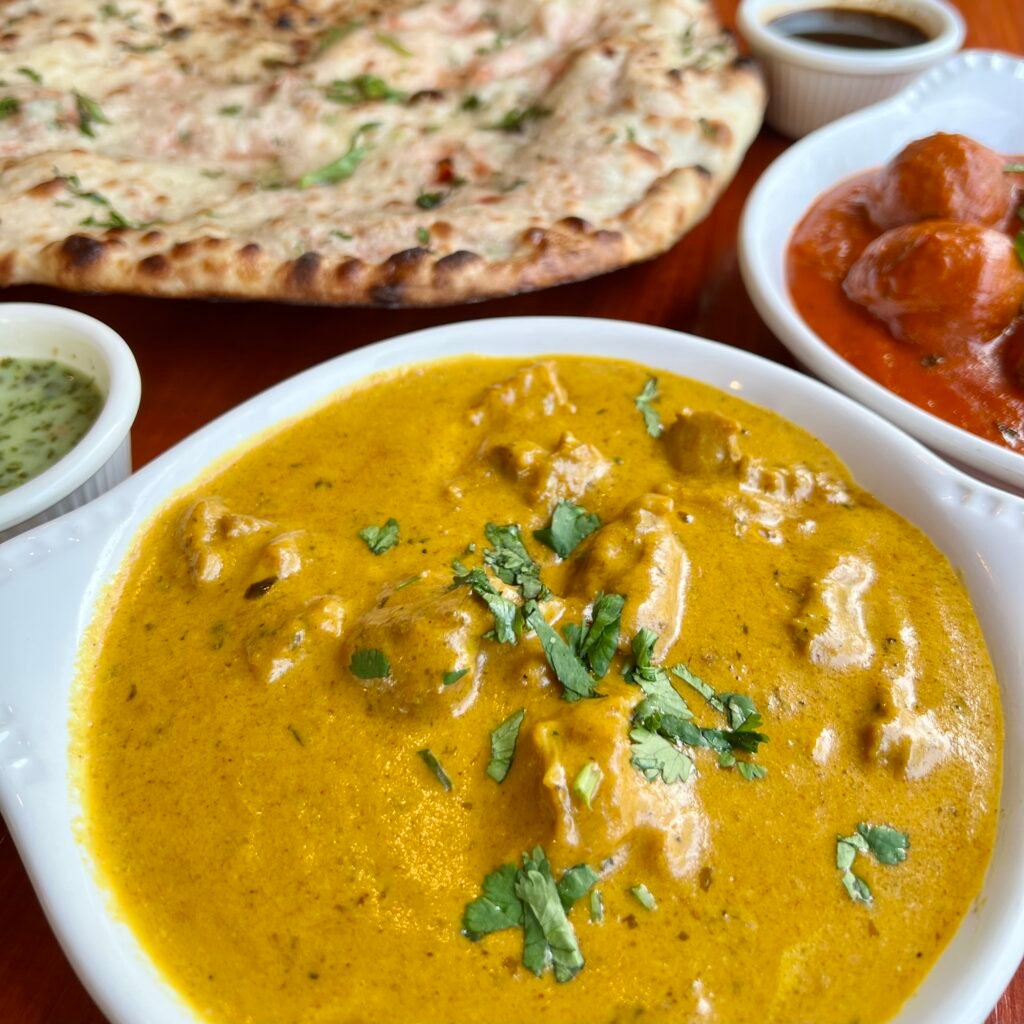 Smooth coconut milk-based curry with mild spices