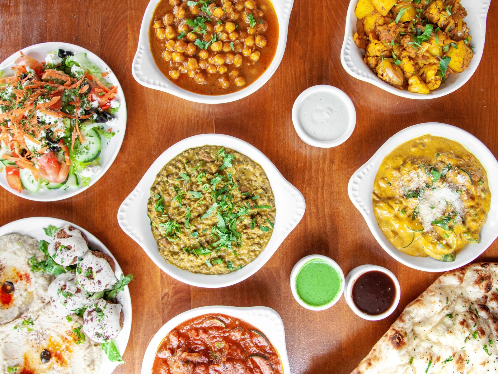 Indian curries, rice, naan, and catering spread